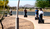 Picture of people riding Segways.