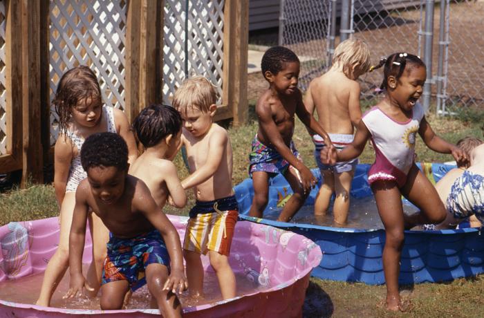 image of children playing in pool
