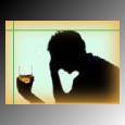 silhouette of man and glass of alcohol