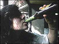 girl drinking beer from bottle