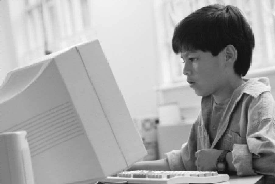 Young Hispanic Student looking working at computer.