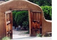 double doors in an adobe wall