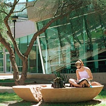 Student studying outside the Law Library
