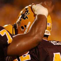 ASU defensive end Connor Banks is congratulated by a teammate after his 9-yard interception return