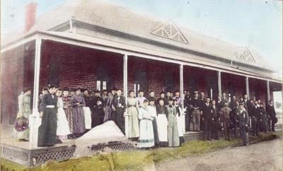 Class portrait on the porch of the Normal School Building, 1890s