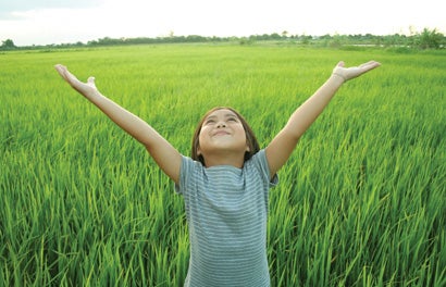 girl raising arms in the air