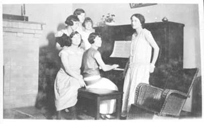 Students singing during free time in the dormitory, 1925