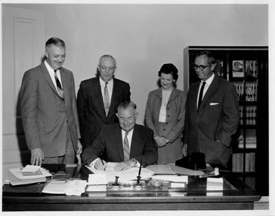 Governor McFarland signs proclamation for name change to Arizona State University, 1958