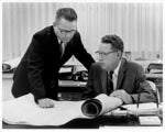 Gilbert Cady (r) looking over plans with John Dutson, ca. 1950s