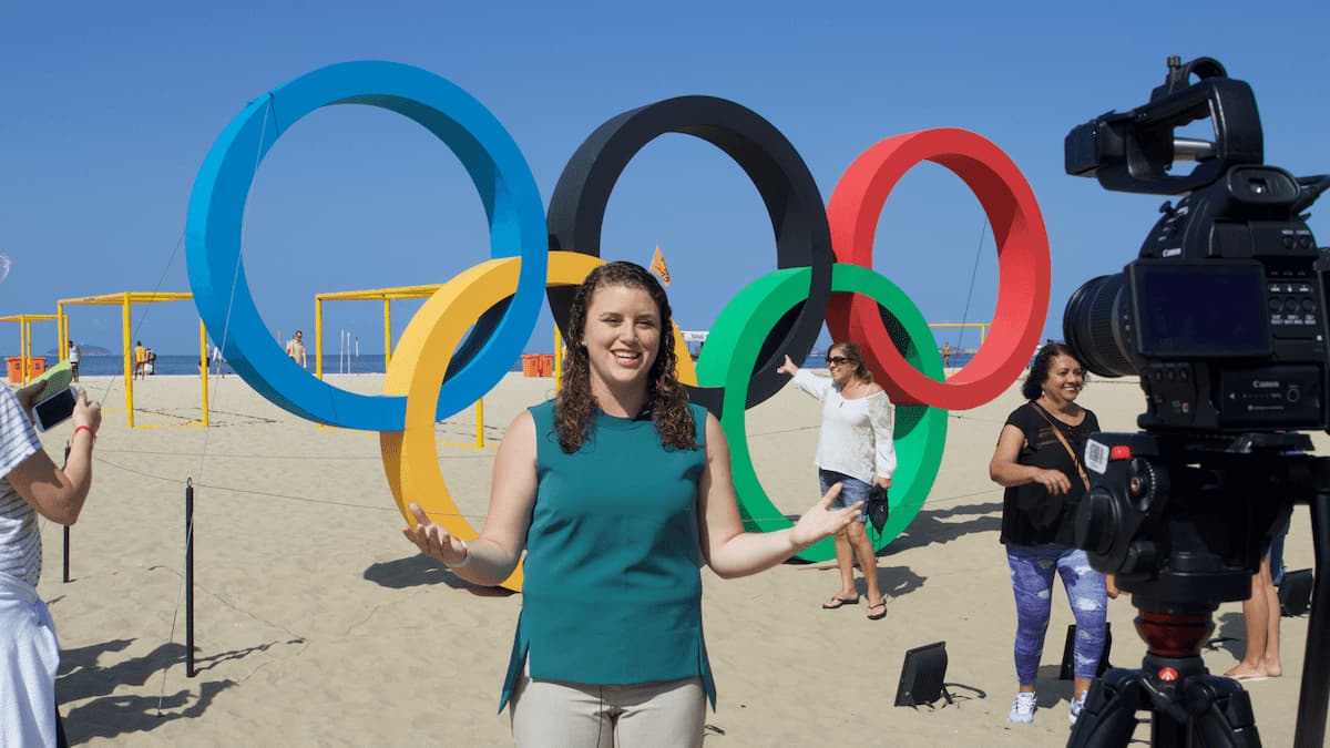 Student reporter in front of a camera