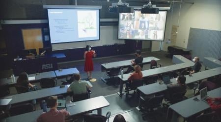 Teacher in classroom with remote and present students