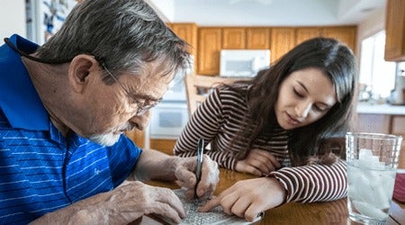 Young woman assisting a man