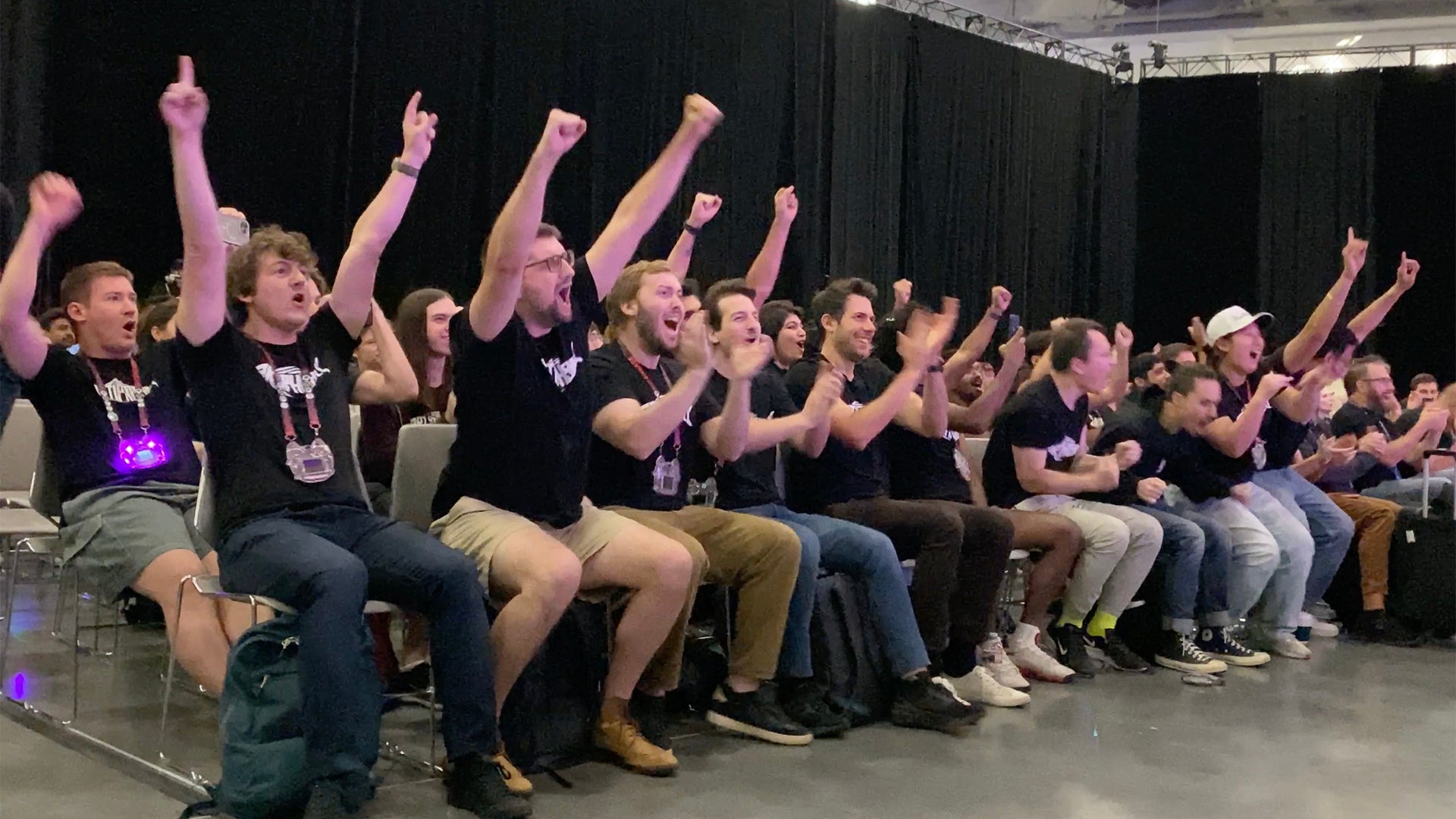 A crowd cheers
