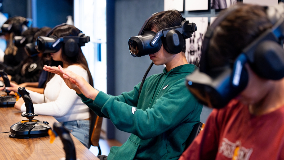 Students wearing VR headsets.