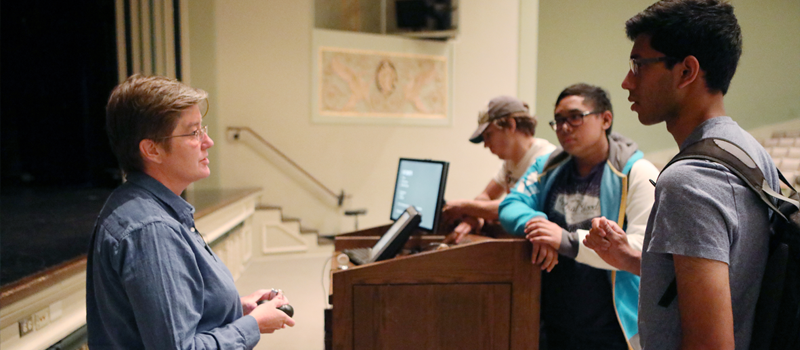 Rebecca Sandefur speaking with students after lecture.